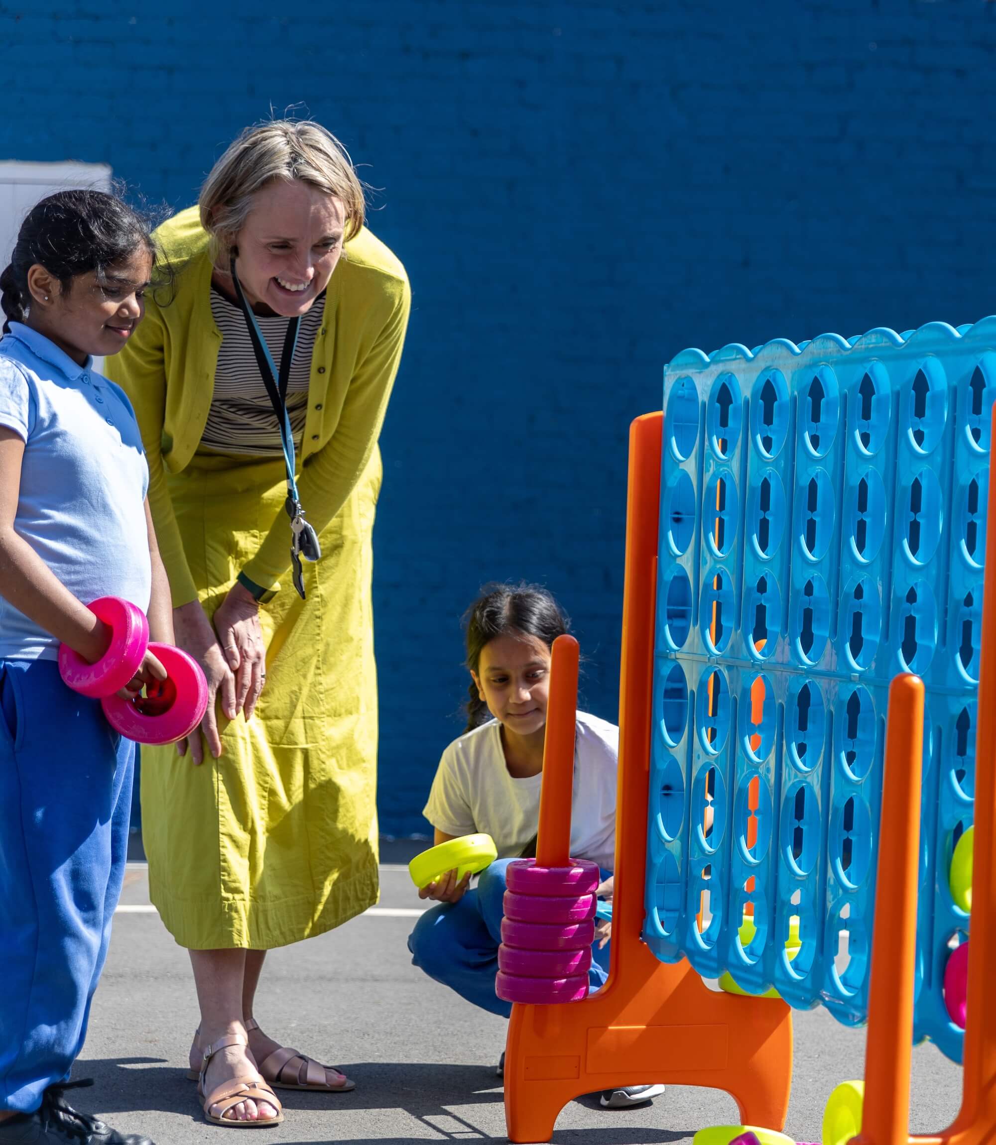 Picture of the Head Teacher, Maria Lewington, playing with children